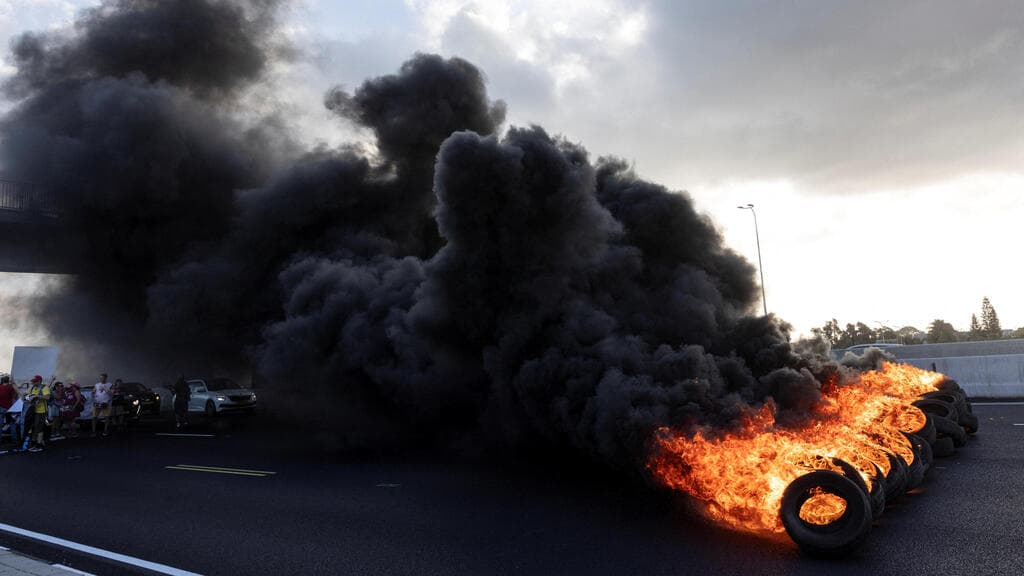 צילום: REUTERS/Nir Elias מחאה ליד יקום