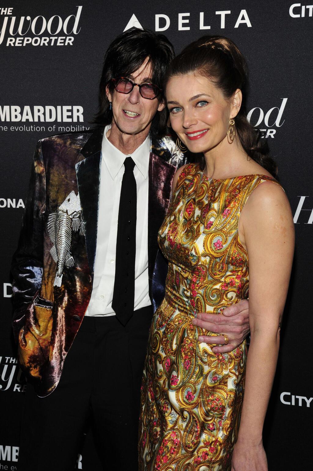 עם ריק אוקסק על השטיח האדום, 2013 (צילום: Charles Sykes/Invision for The Hollywood Reporter/AP Images) פאולינה פוריצקובה וריק אוקסק על השטיח האדום, 2013