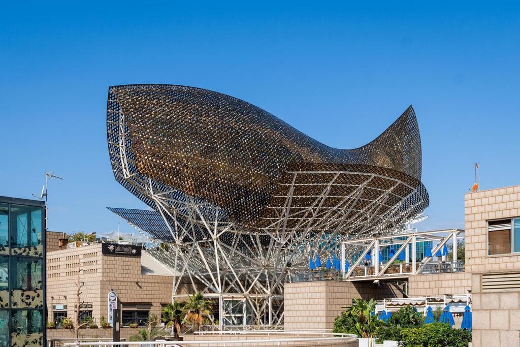  Frank Gehry's modern El Peix d'Or sculpture is located in Barcelona's Vila Olimpica