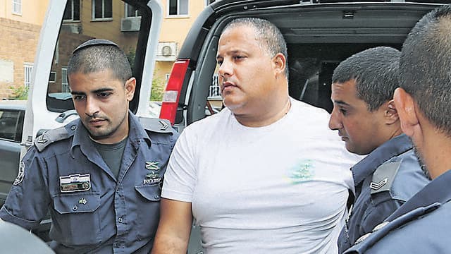 אלון חסן מובא למעצר, יוני 2014