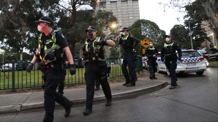 אוסטרליה שוטרים אוכפים סגר ב אזור ב מלבורן נגיף קורונה