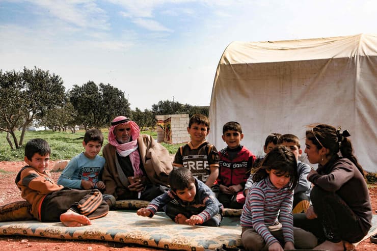 סוריה עבד א-ראזק חאתון איבד 13 ילדים מלחמת אזרחים 10 שנים למלחמה