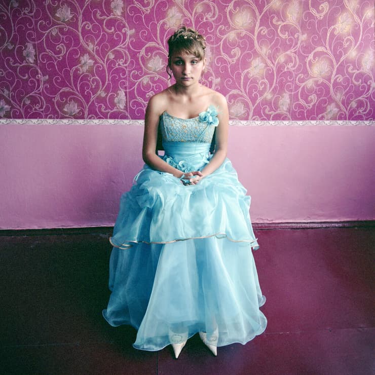 Girl in a boarding school for youth from broken homes, dressed for graduation, Ukraine 2008