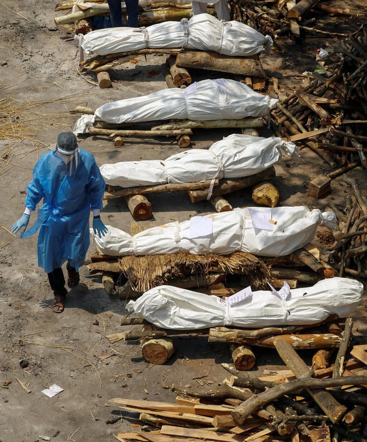 הודו קורונה שורפים גופות של קורבנות ניו דלהי