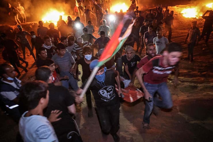 התפרעויות עימותים הטרדה לילית מחאה גדר גבול רצועת עזה פלסטינים ליד חאן יונס בדרום הרצועה