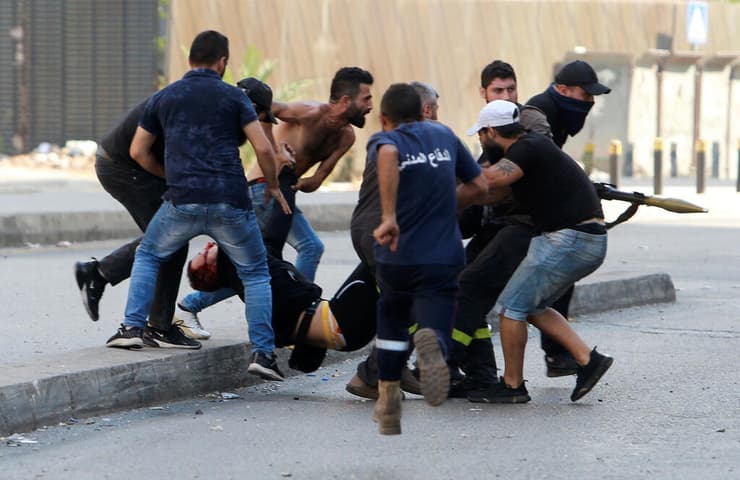 לבנון ביירות מהומות עימותים תומכי חיזבאללה אמל מפגינים שופט חקירת נמל ביירות ירי כנראה מצד נוצרים