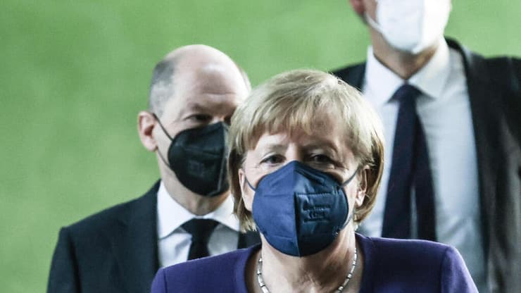 אנגלה מרקל אולף שולץ קנצלר קנצלרית גרמניה מסיבת עיתונאים הגבלות קורונה