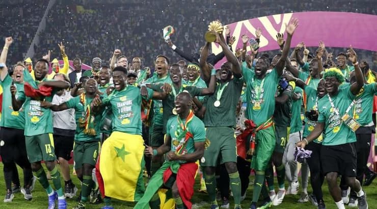 שחקני סנגל חוגגים זכייה (רויטרס) שחקני סנגל חוגגים זכייה