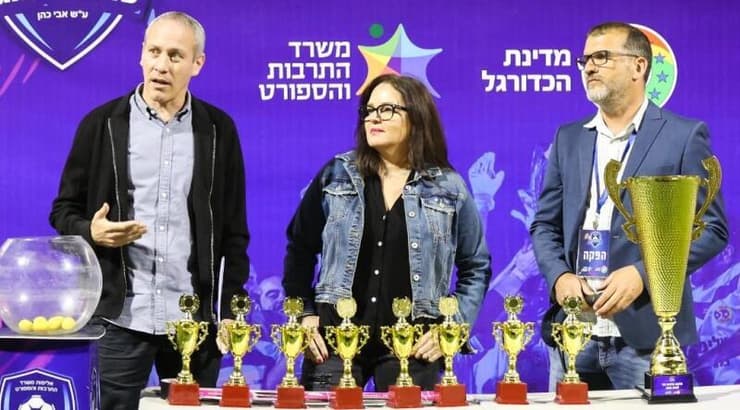 טקס הגרלת המשחקים בהשתתפות שר התרבות והספורט חילי טרופר, דורית כהן ומורן גרא, מנכ"ל מדינת הכדורגל (איציק בלניצקי) טקס הגרלת המשחקים בהשתתפות שר התרבות והספורט חילי טרופר, דורית כהן ומורן גרא, מנכ"ל מדינת הכדורגל