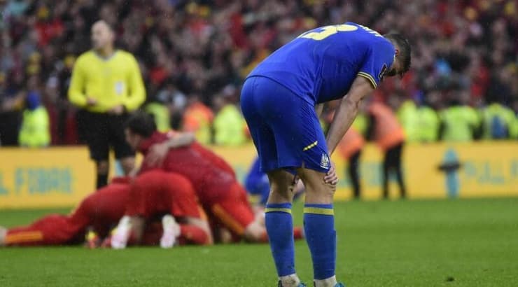 שחקני וויילס חוגגים (רויטרס) שחקני וויילס חוגגים