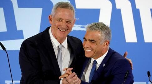 יאיר לפיד ובני גנץ (רויטרס) יאיר לפיד ובני גנץ