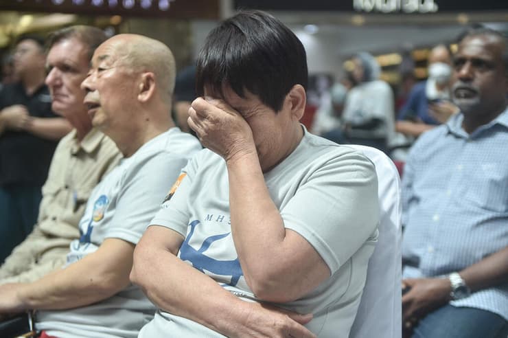 המטוס המלזי טיסת מלזיה איירליינס MH370 קרוב משפחה ב טקס ל קורבנות ב סין