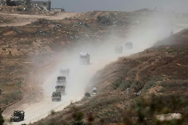 כוחות צה"ל ב כביש מסדרון שמסתר את צפון מדרום רצועת עזה