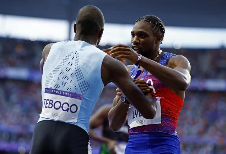 האצן האמריקאי נואה ליילס עם לטסילה טבוגו