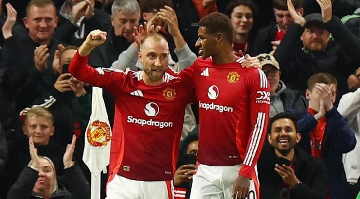 מרכוס רשפורד וכריסטיאן אריקסן מאושרים