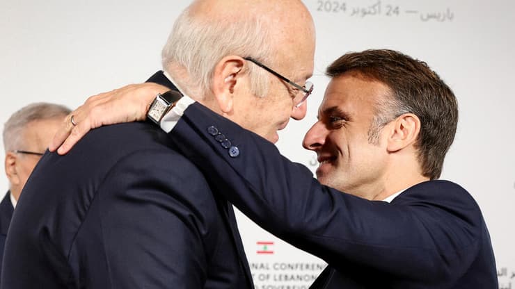 מקרון וראש ממשלת לבנון מקיאתי. צרפת תתרום כ-100 מיליון יורו (צילום: ALAIN JOCARD/Pool via REUTERS) נשיא צרפת עמנואל מקרון