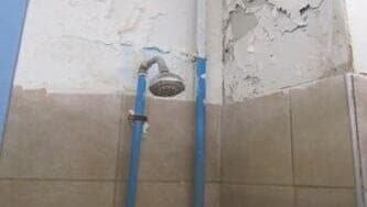 צילם 15 תמונות של חיילים בתאי השירותים והמקלחות (צילום: מבקר המדינה) דוח מבקר המדינה מקלחת לא תקינה שיזפון בית ספר לשריון צה"ל שיריון