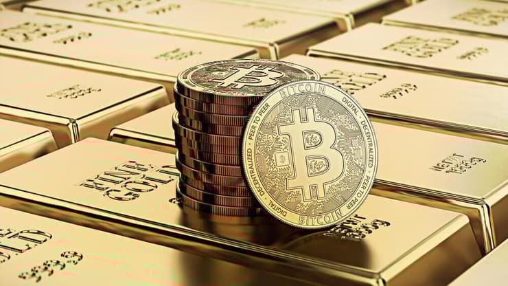 אילוסטרציה של ביטקוין וזהב (צילום: Shutterstock) אילוסטרציה של ביטקוין וזהב