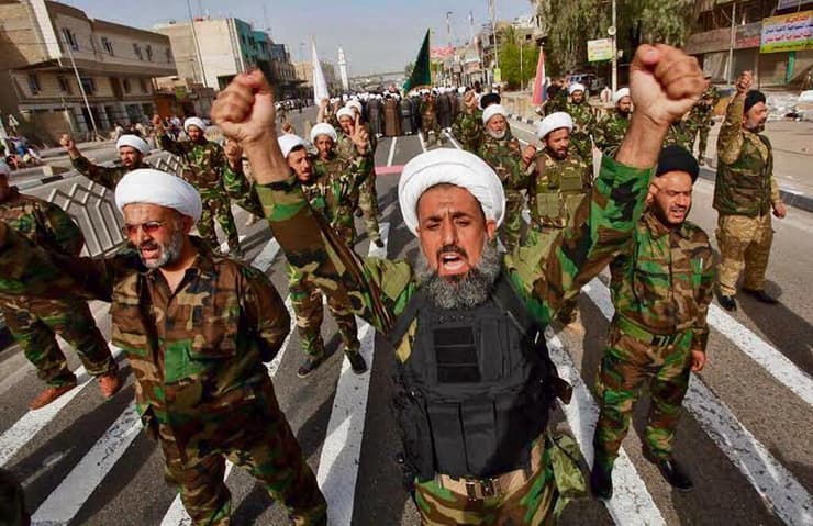 ארכיון. אנשי מיליציה פרו-איראנית בעיראק (צילום: Alaa Al-Marjani, Reuters) חברי "ההתנגדות האיסלאמית בעיראק"