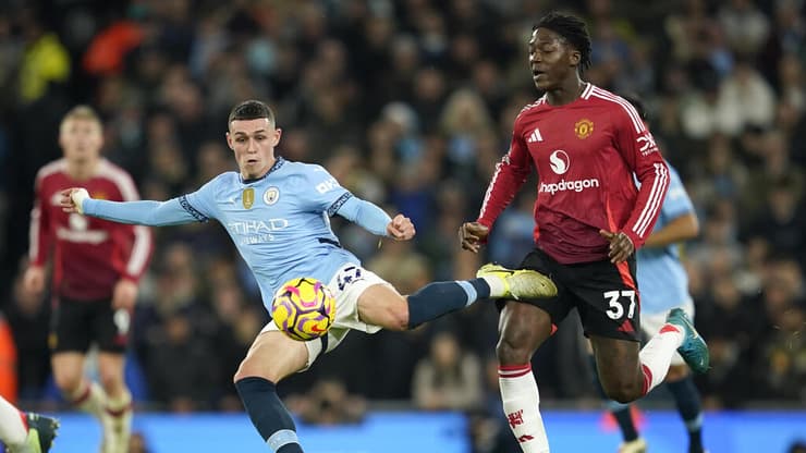 מאינו עם פודן (צילום: AP Photo/Dave Thompson) מנצ'סטר סיטי - מנצ'סטר יונייטד