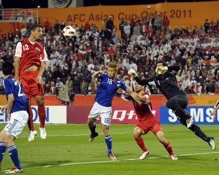 סוריה נגד יפן ב-2011. האוהדים התחלקו בין תומכי אסד למתגנדים (צילום: Koki Nagahama/Getty Images) נבחרת סוריה בכדורגל