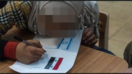 "בחיים האמיתיים שום דבר לא ודאי". ילדה סורית מציירת דגל ישראל לצד דגל סוריה הישן (צילום: דובר צה"ל) הסיוע ההומניטרי מישראל ל סוריה במבצע "שכנות טובה"