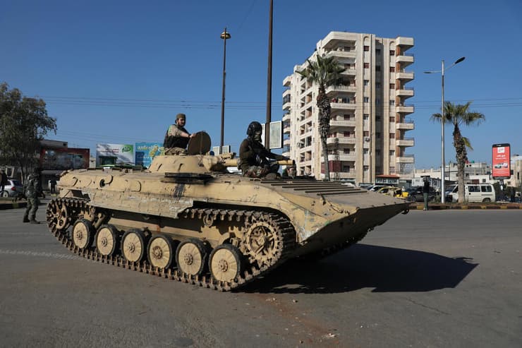 צילום: REUTERS/Khalil Ashawi המשטר החדש ב סוריה מבצע צבאי בעיר חומס