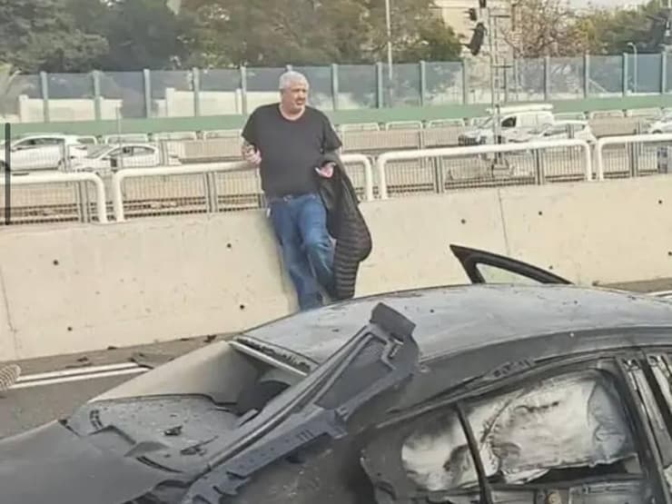 לחיאני ליד רכבו אחרי הפיצוץ בנתיבי איילון שלמי לחיאני עומד ליד הרכב לאחר ניסיון החיסול בלה גווארדיה