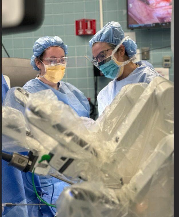 Physician associates assist in a robotic surgery procedure, using advanced technology for precision and minimally invasive care 