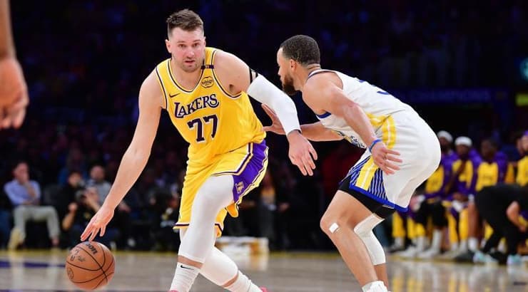 לוקה דונצ'יץ' מול סטף קרי (רויטרס) לוקה דונצ'יץ' מול סטף קרי