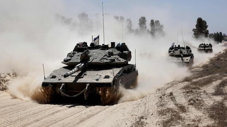 המחבלים הפעילו מטען על הטנק ואז ירו. ארכיון (צילום: Jack GUEZ / AFP) כוחות צה"ל בכניסה לעזה