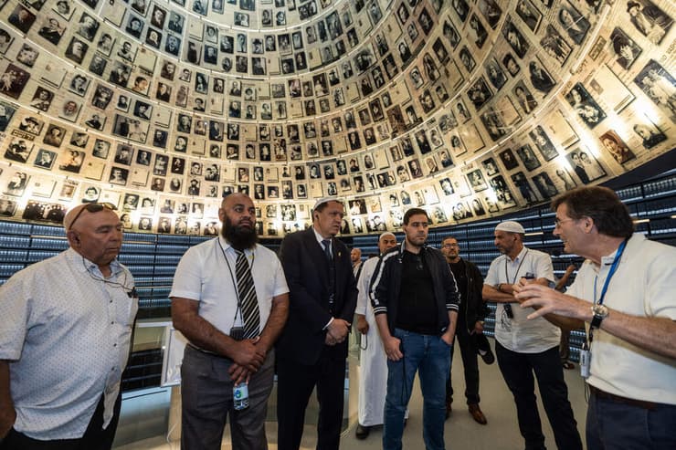 French Imam Hassen Chalghoumi (3rd L) and English Imam Dahri Nour Mouhammad (2nd L), part of a delegation of Imams and Muslim community leaders from France, Belgium, the Netherlands, Italy and the United Kingdom, visit the Yad Vashem Holocaust Memorial Museum in Jerusalem, on July 8, 2025 