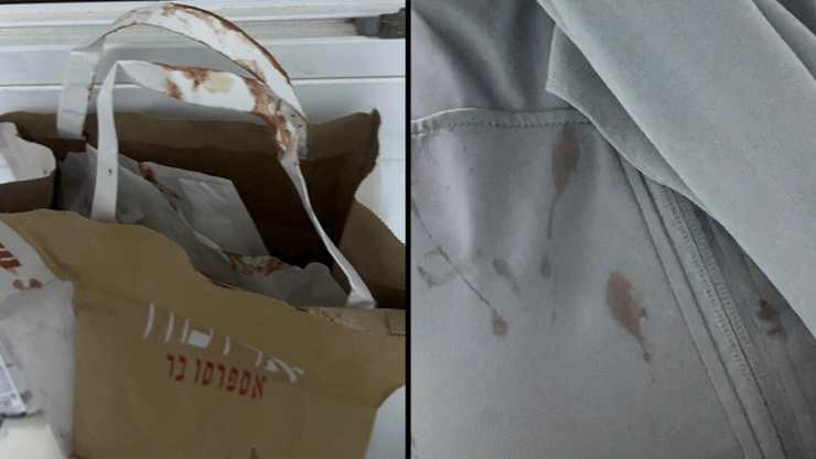 דם על השקית שהחזיקה האישה שהותקפה