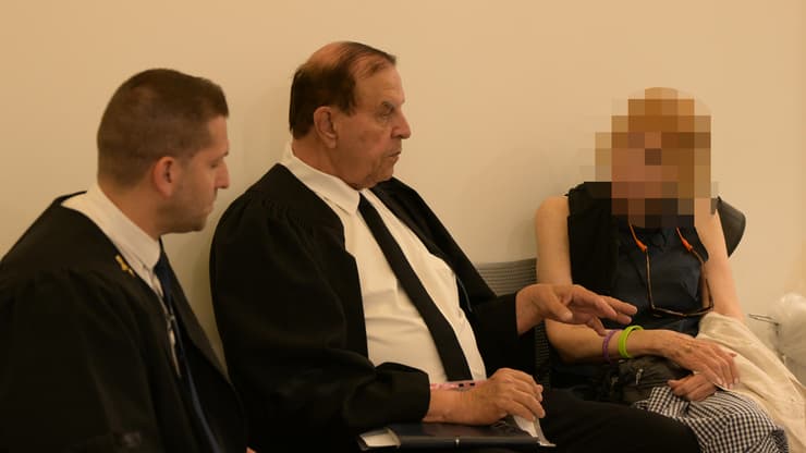 The suspect on the right, Attorney Guy Erenberg on the left, Attorney Giora Zilberstein in the middle