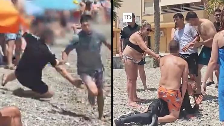 ספרד מתרחצים עצרו מהגרים ששחו ל חוף