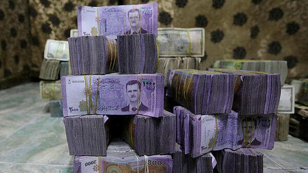 השטרות הסוריים עם הדיוקן של בשאר אסד