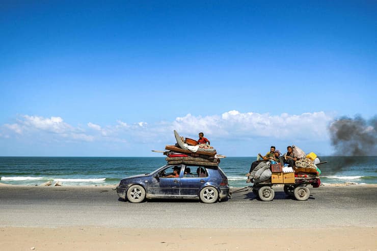 עזה פלסטינים פליטים עוזבים מצפון הרצועה דרומה