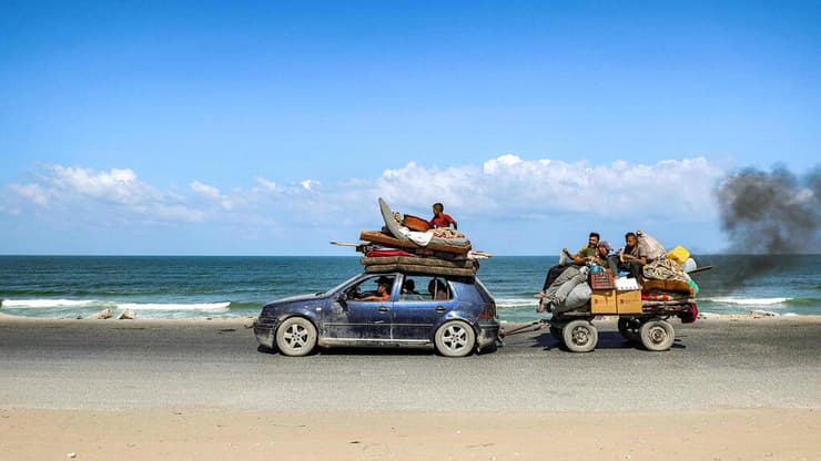 עזה פלסטינים פליטים עוזבים מצפון הרצועה דרומה