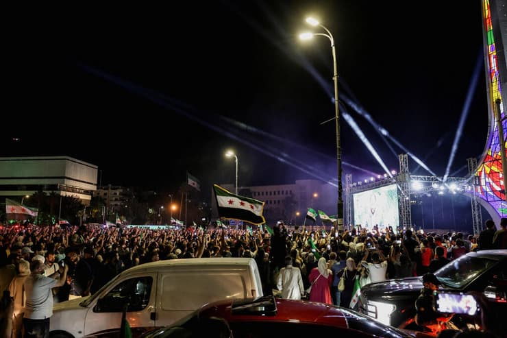 צילום: רויטרס/REUTERS/Khalil Ashawi צופים ב דמשק בנאום נשיא סוריה אחמד א-שרע באו"ם