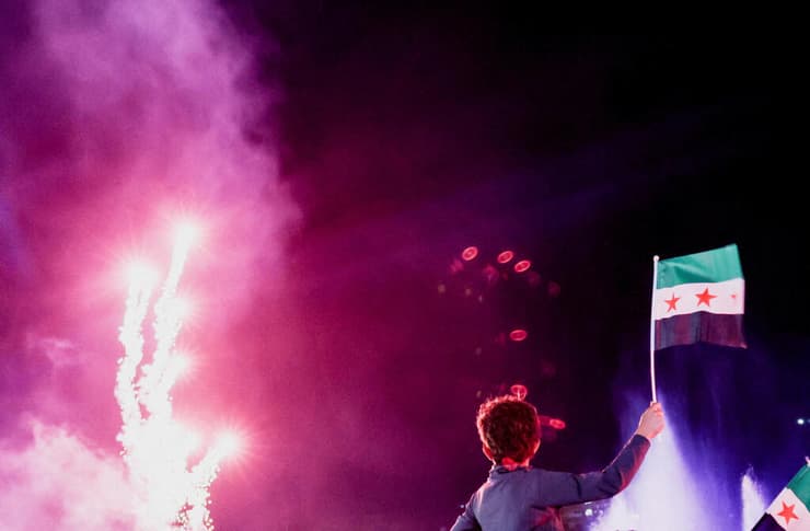 צילום: רויטרס/REUTERS/Khalil Ashawi צופים ב דמשק בנאום נשיא סוריה אחמד א-שרע באו"ם