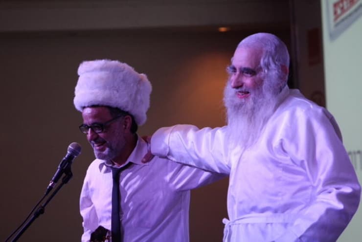 הרב פרומן לצד אהוד בנאי