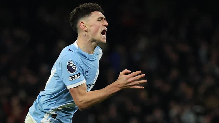 פודן חוגג צמד דרמטי (צילום: REUTERS/Phil Noble ) פודן