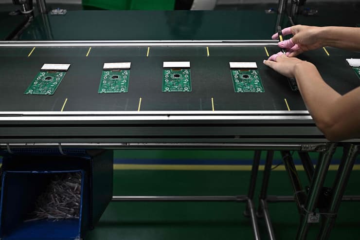 צילום: Lillian SUWANRUMPHA / AFP מחשבון מחשבונים שוק בנגקוק