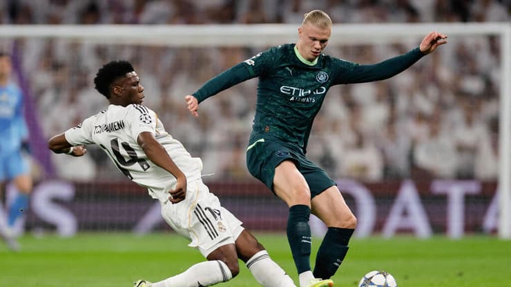 שחקן מנצ'סטר סיטי ארלינג הולאנד מול שחקן ריאל מדריד אורליאן צ'ואמני