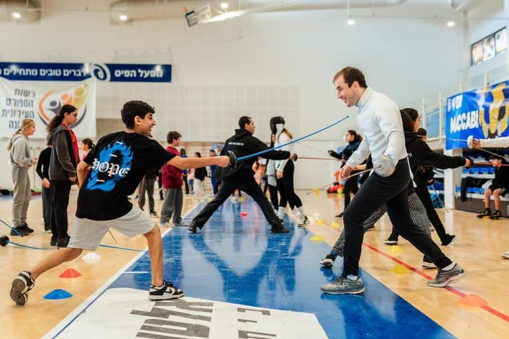 "לא רואים בזה מחויבות או עול" (צילום: באדיבות הוועד האולימפי) כתבת התנדבות