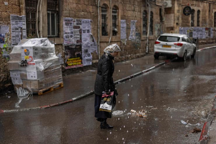 יום גשום בירושלים (צילום: ILIA YEFIMOVICH / AFP) מאה שערים