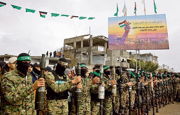 חמושי חמאס ברצועת עזה | צילום: Omar AL-QATTAA / AFP