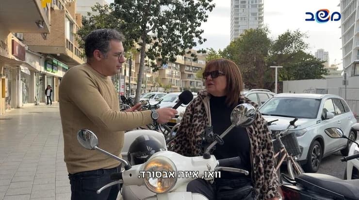 אסי צובל ואחת התושבות במשאל הרחובות