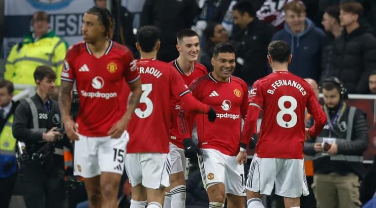 שחקני מנצ'סטר יונייטד חוגגים (IMAGO) שחקני מנצ'סטר יונייטד חוגגים