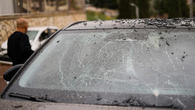 רכב נפגע בחצור הגלילית (צילום: Jalaa MAREY / AFP) הזירה בחצור הגלילית